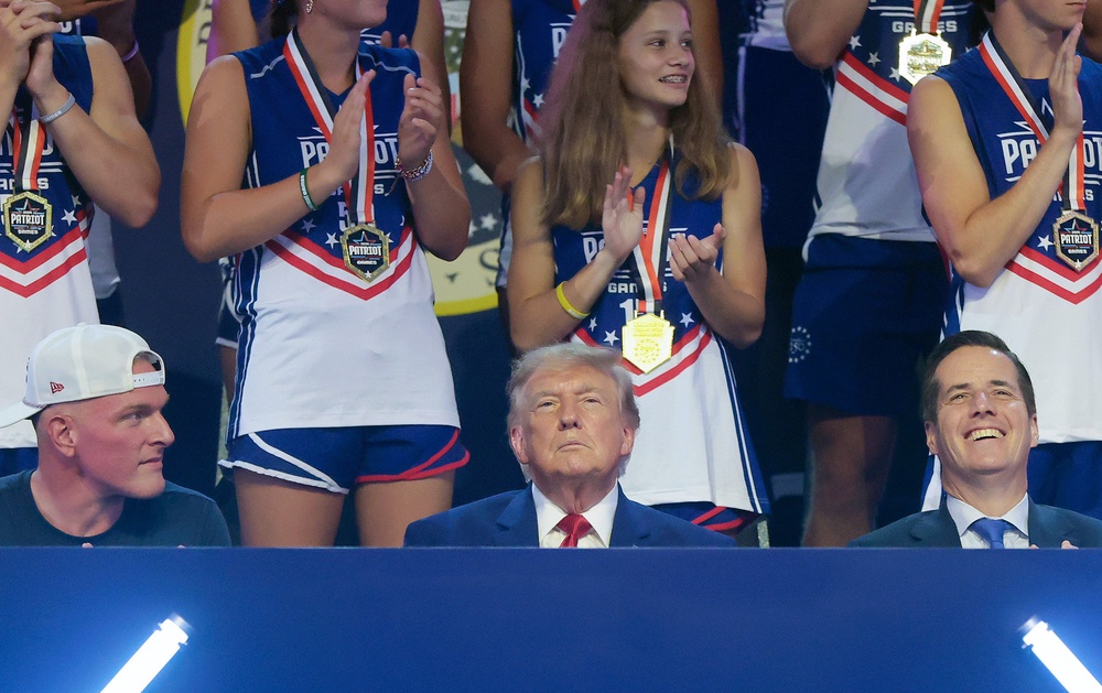 The president takes in the festivities with ESPN’s Pat McAfee (left) and Senator Bernie Moreno (R-OH) (right) (Getty)