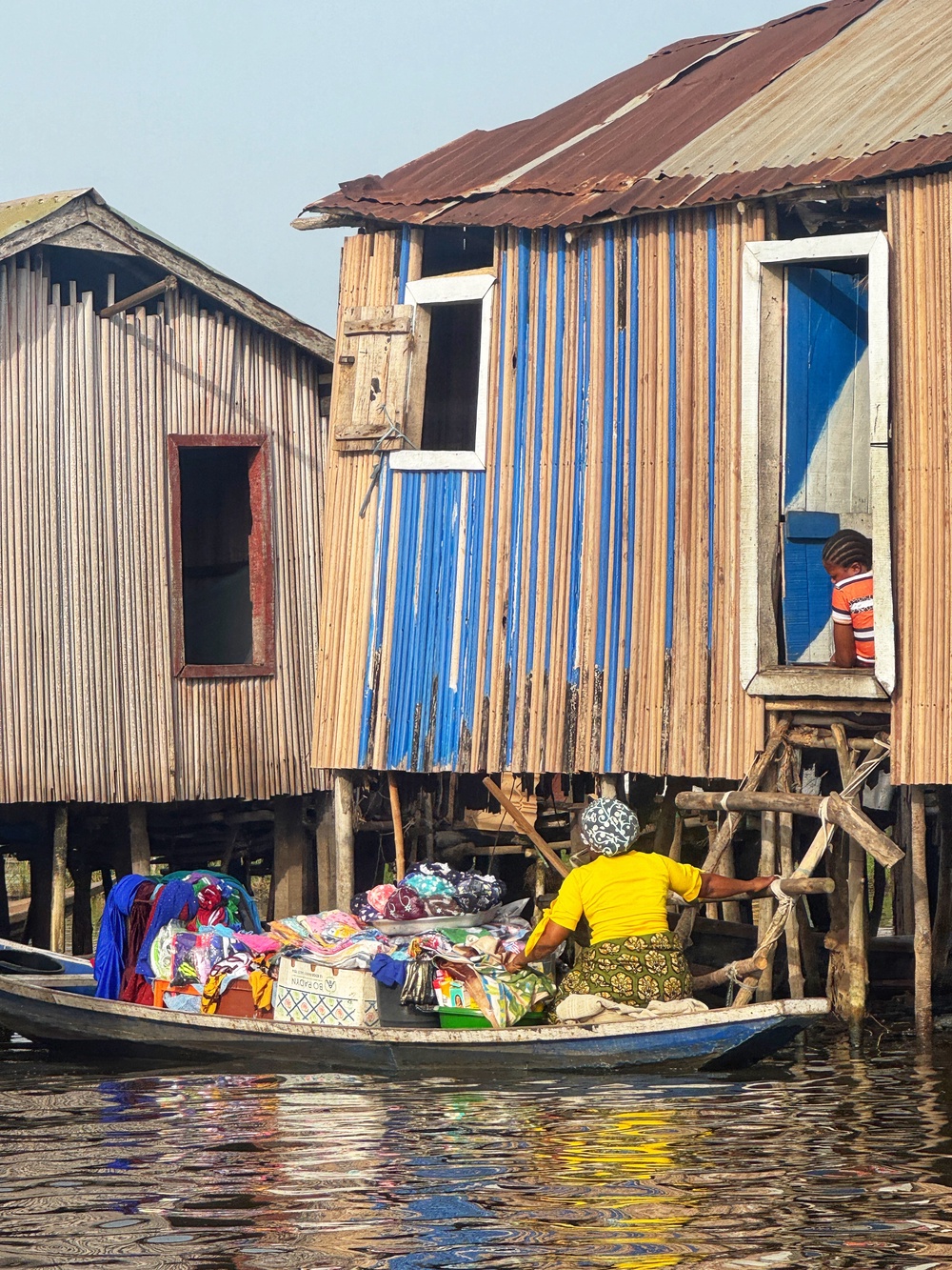 25,000 people live, work and socialise in buildings hoisted on stilts above Lake Nokoué (Phil Thomas)