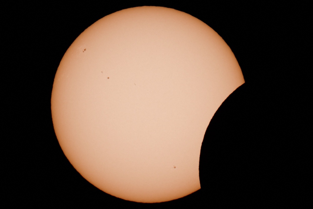 A few of the moon partially covering the sun during a solar eclipse as seen from Arija, Spain (REUTERS)