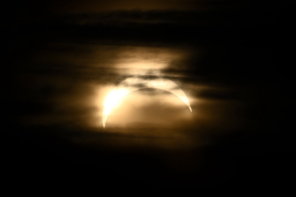 The partial eclipse seen from Observatorielunden park in central Stockholm, Sweden (TT NEWS AGENCY/AFP via Getty Ima)