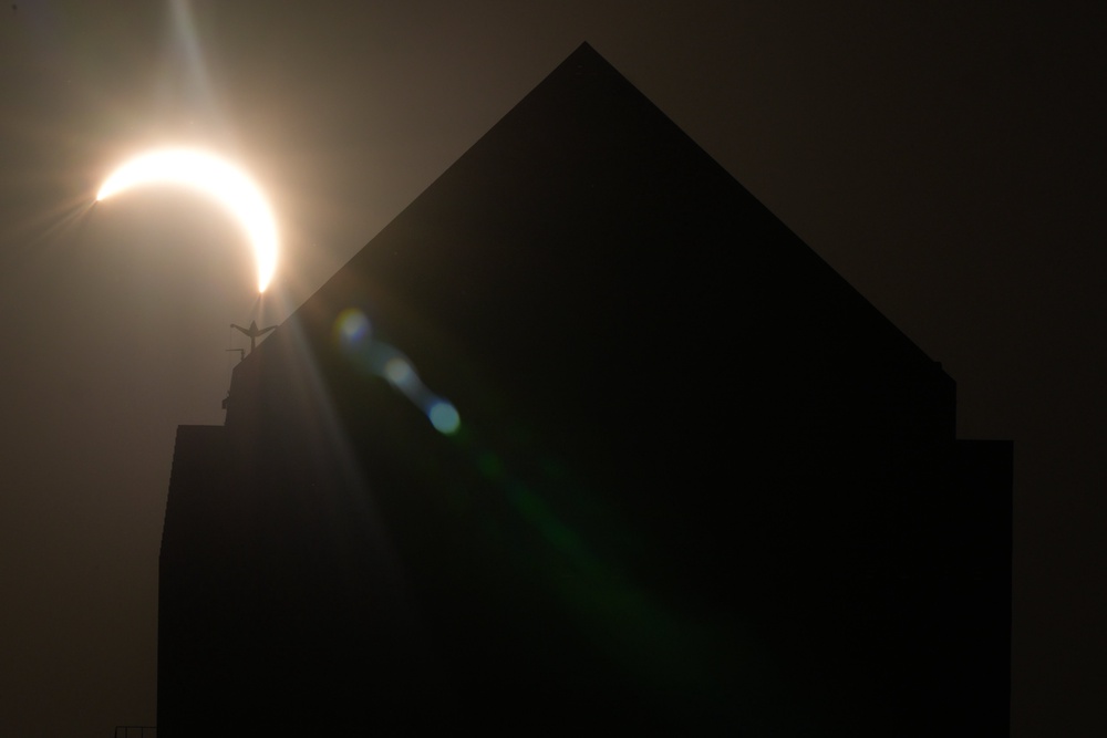 The sun over Canary Wharf, London during the solar eclipse (Ian West/PA Wire)