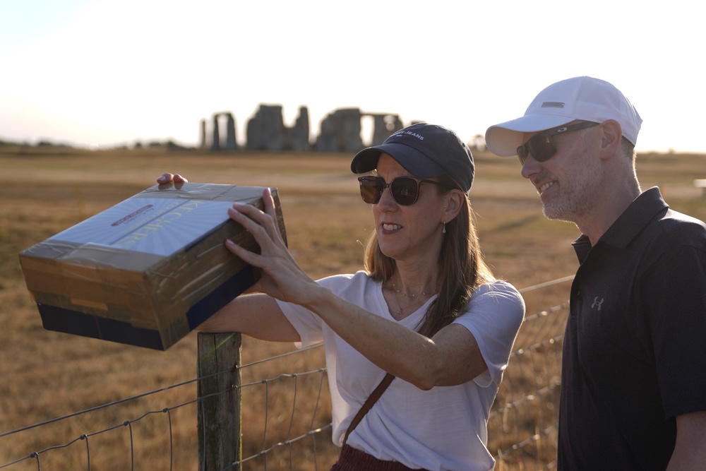 People with a home made device to watch the solar eclipse at Stonehenge (PA) (PA Wire)