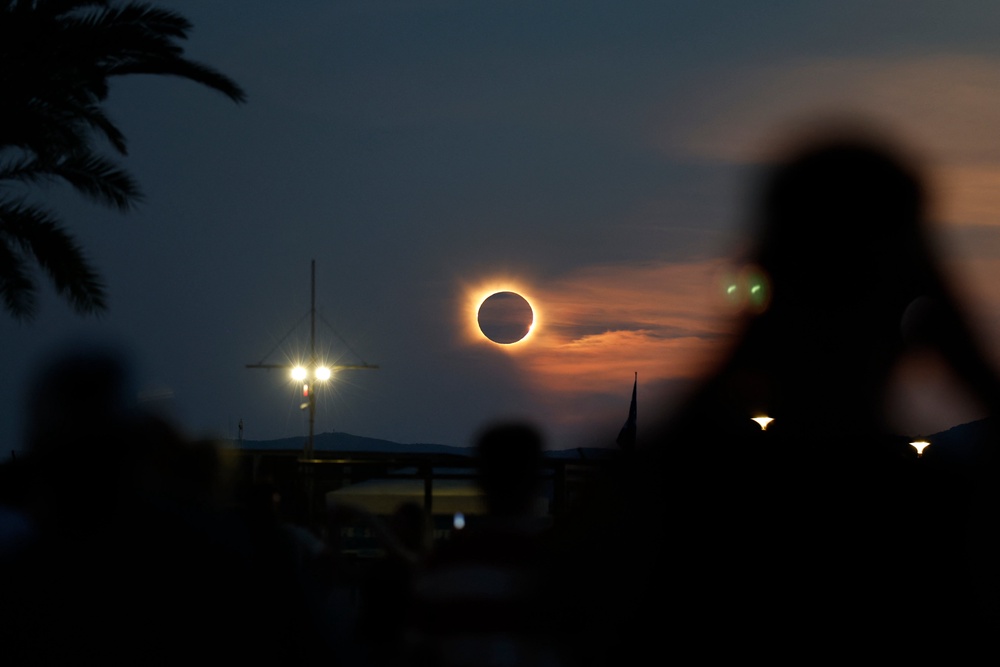 The sun's corona glows as the moon completely blocks the sun during the totality phase of the total solar eclipse as seen from Arenal beach in Llucmajor, on the Balearic island of Mallorca (AFP/Getty)