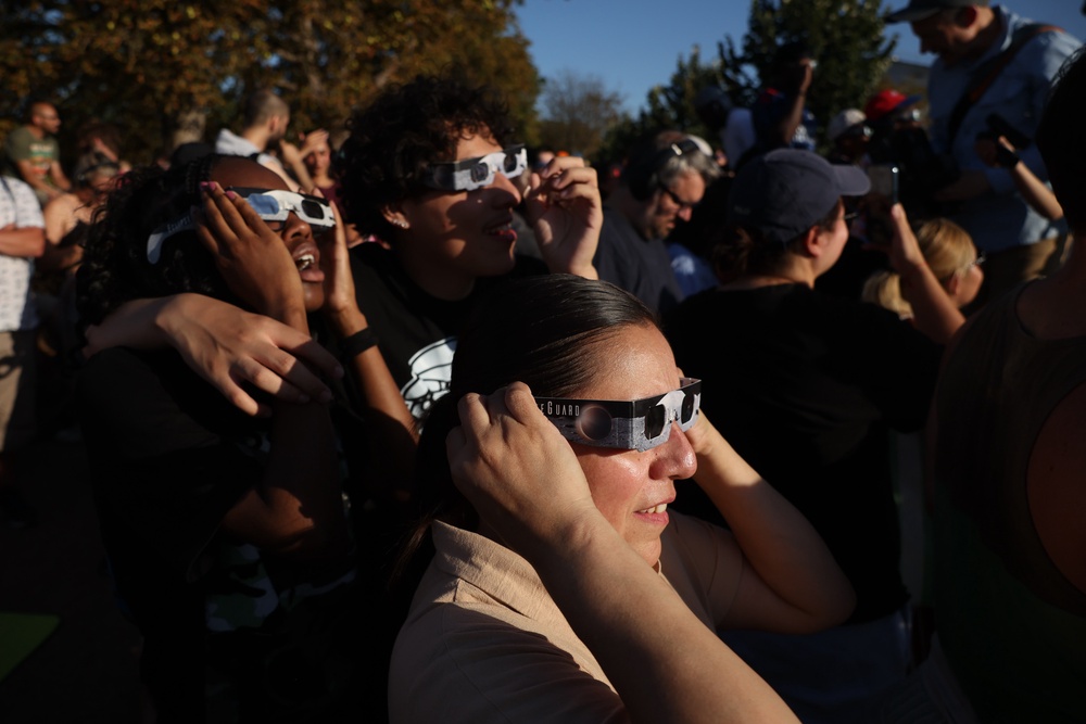 People gather to watch the partial solar eclipse in Greenwich Park on August 12, 2026 in London, United Kingdom (Getty)