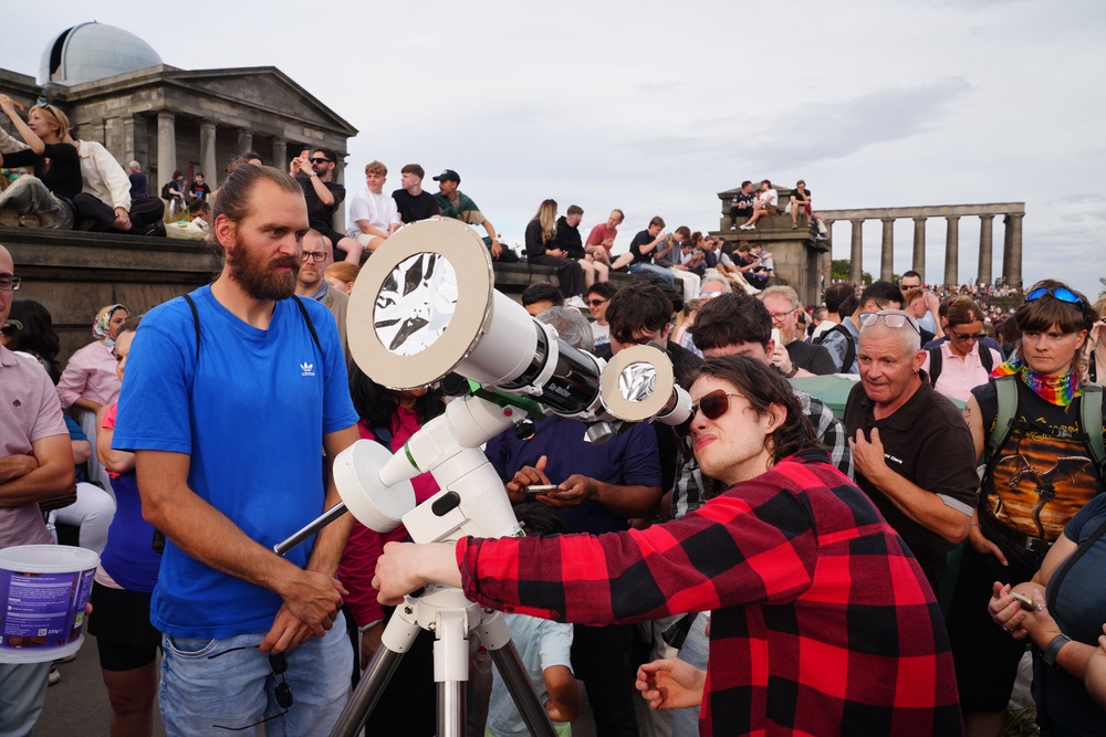 People gathering to watch the solar eclipse on Calton Hill, Edinburgh (Jane Barlow/PA) (PA Wire)