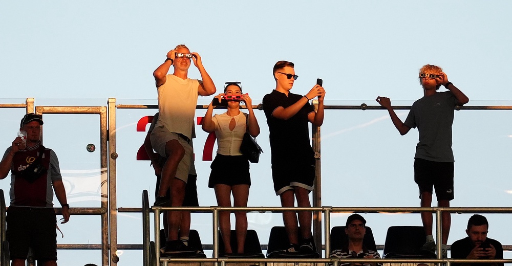 Spectators at the UEFA Super Cup final in Salzburg watch the solar eclipse (Adam Davy/PA) (PA Wire)