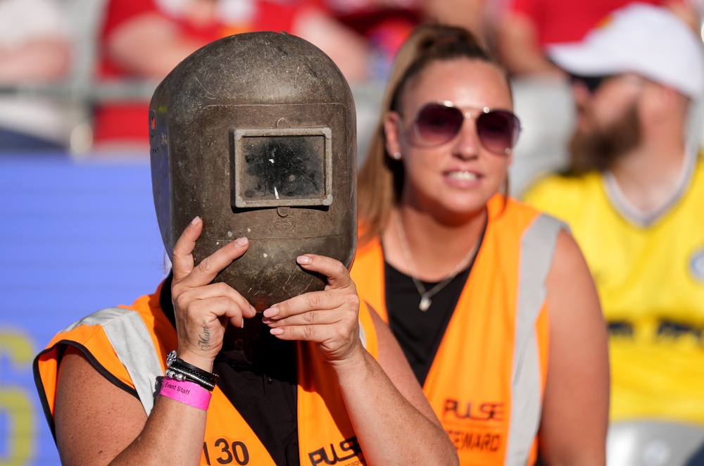 Stewards wearing welding helmets to watch the solar eclipse ahead of a pre-season match at Croke Park, Dublin (Niall Carson/PA) (PA Wire)