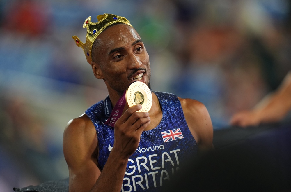 Matt Hudson-Smith celebrates winning his gold medal (PA)