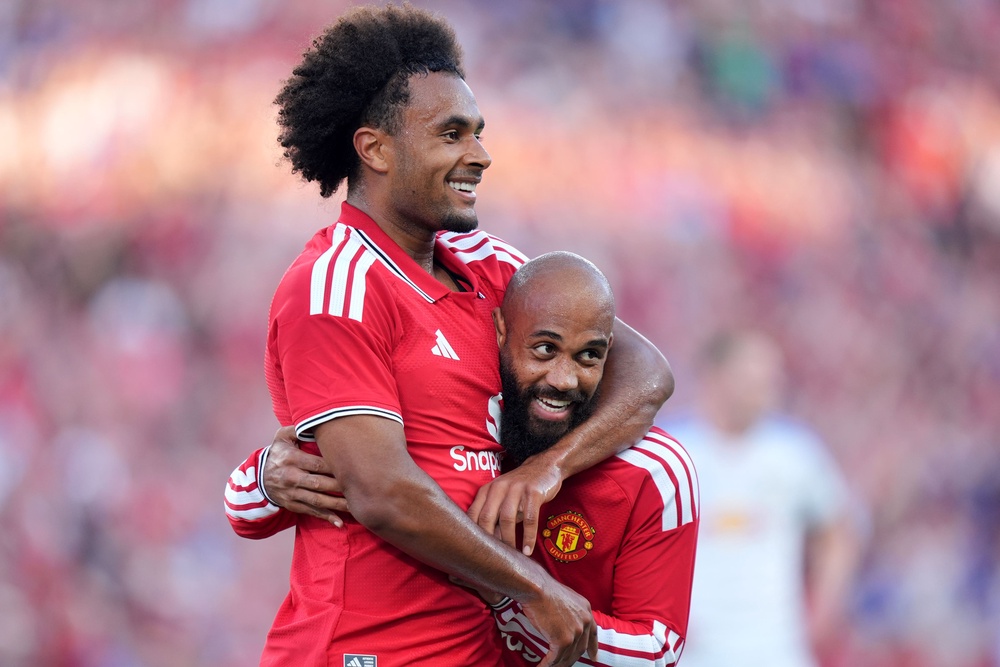 Joshua Zirkzee celebrates with Manchester United teammates Bryan Mbeumo (PA Wire)