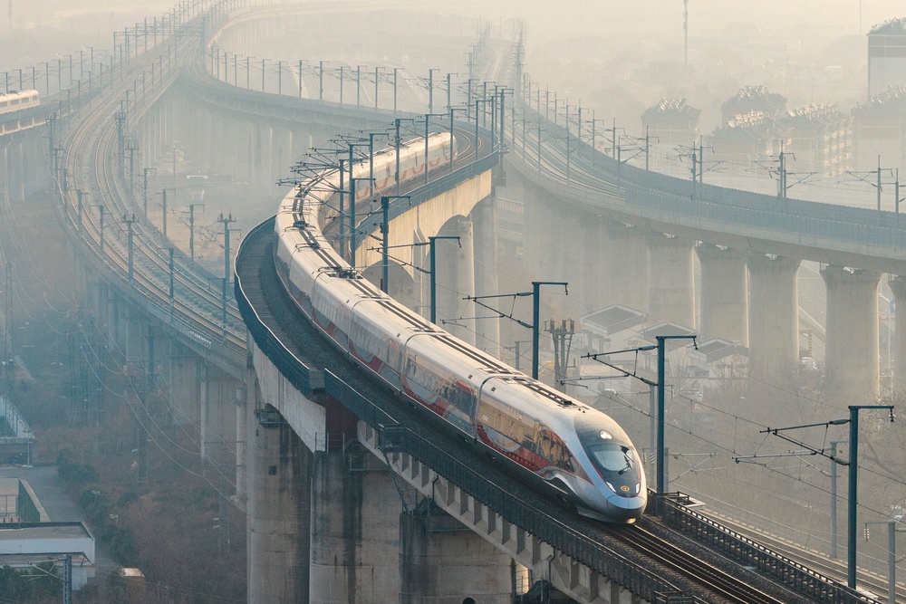 A high-speed train runs on elevated tracks in Nanjing, Jiangsu province, China on 25 January 2026 (AFP via Getty)