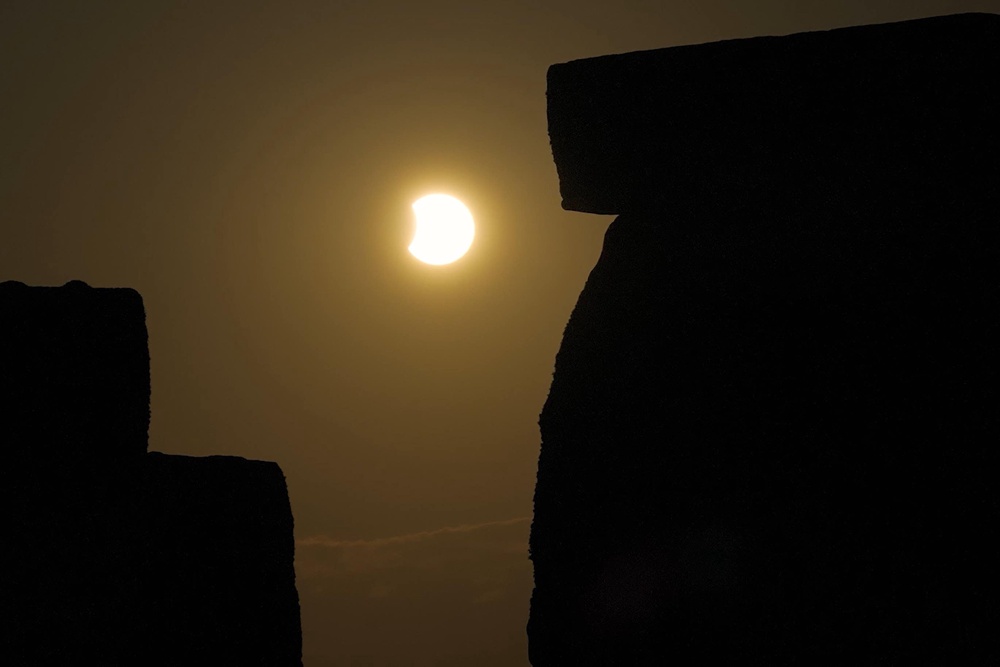 English Heritage image of the eclipse peaking over Stonehenge (English Heritage/PA)