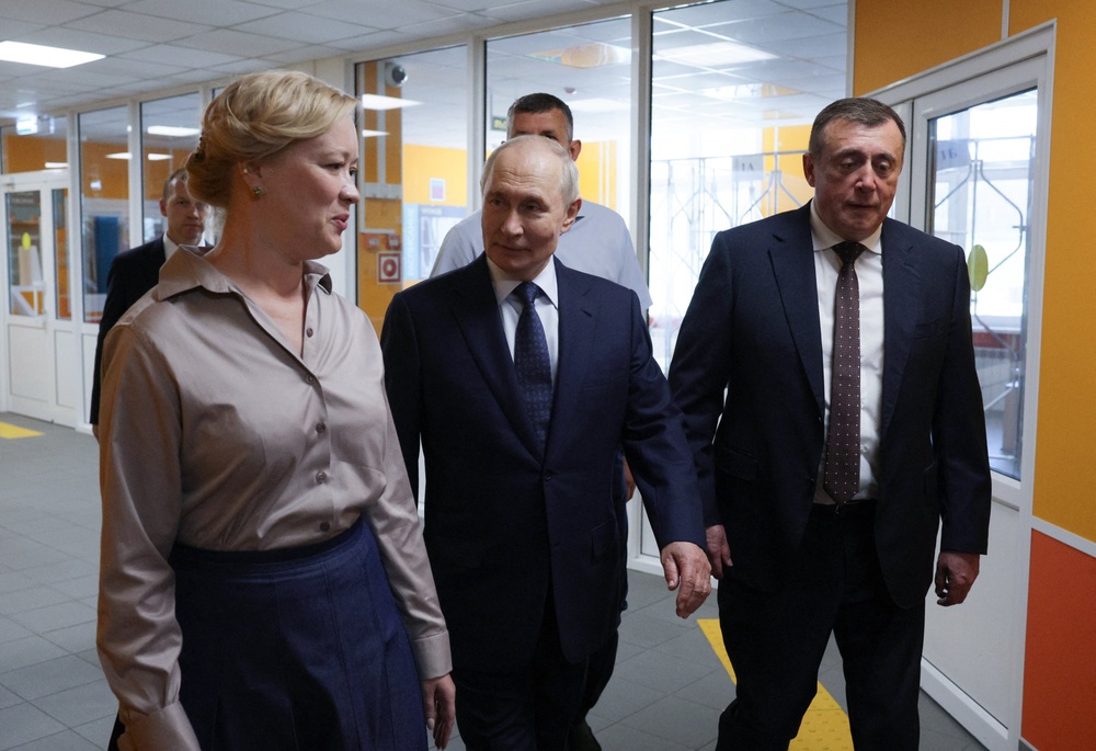 In this pool photograph distributed by the Russian state agency Sputnik, Russia's President Vladimir Putin visits a school on Iturup island, one of four islands in the contested chain known as the Kuril Islands in Russia and the Northern Territories in Japan, on August 13, 2026. (Photo by Gavriil Grigorov / POOL / AFP via Getty Images) (AFP/Getty)
