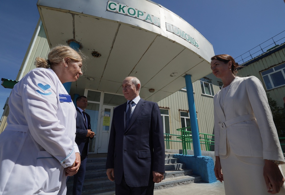 In this pool photograph distributed by the Russian state agency Sputnik, Russia's President Vladimir Putin visits a hospital on Iturup island, one of four islands in the contested chain known as the Kuril Islands in Russia and the Northern Territories in Japan, on 13 August 2026 (AFP/Getty)