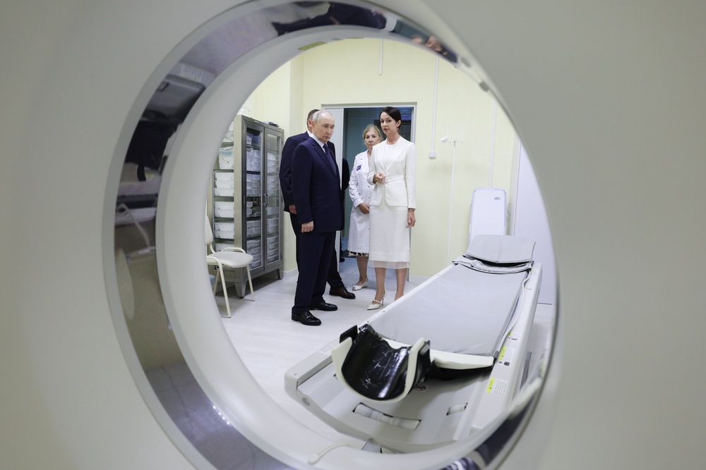 Iturup Island is the largest of the Kuril Islands of Russia's fareast. Putin is pictured here visiting the central district hospital at Kitovoye village on the (Sputnik)