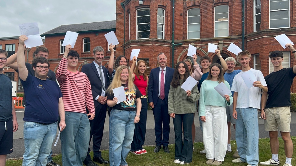 Stormont education minister Paul Givan speaks with students at Friends’ school Lisburn as they receive their A-Level results. (Claudia Savage/PA)