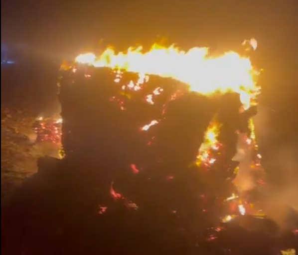 The attackers set fire to a large pile of livestock feed meant for the villagers' sheep (Mohammad Hesham)