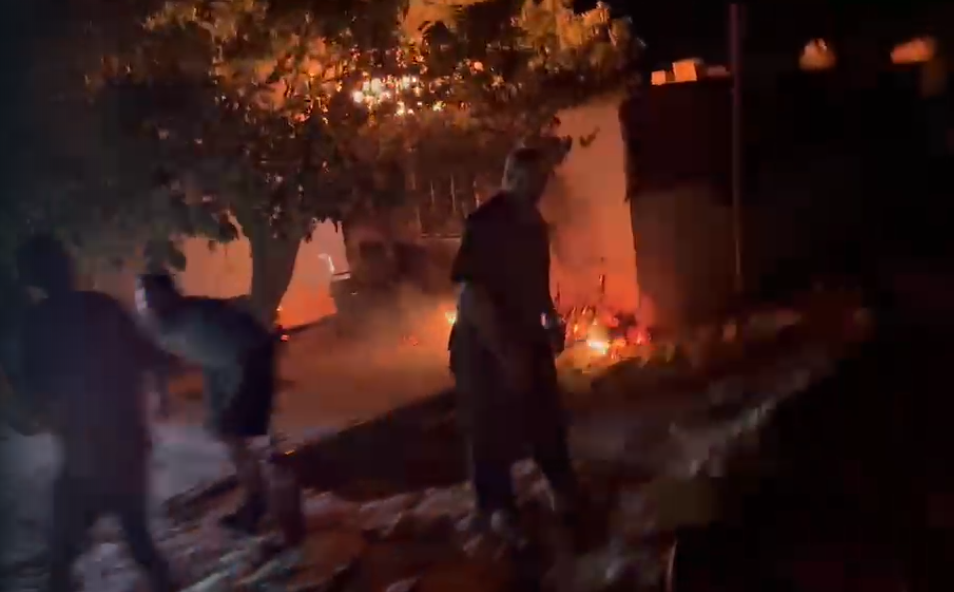 Residents rushed to put out the fires following the attack on 5 August (Hamza Abu-Jundeya)