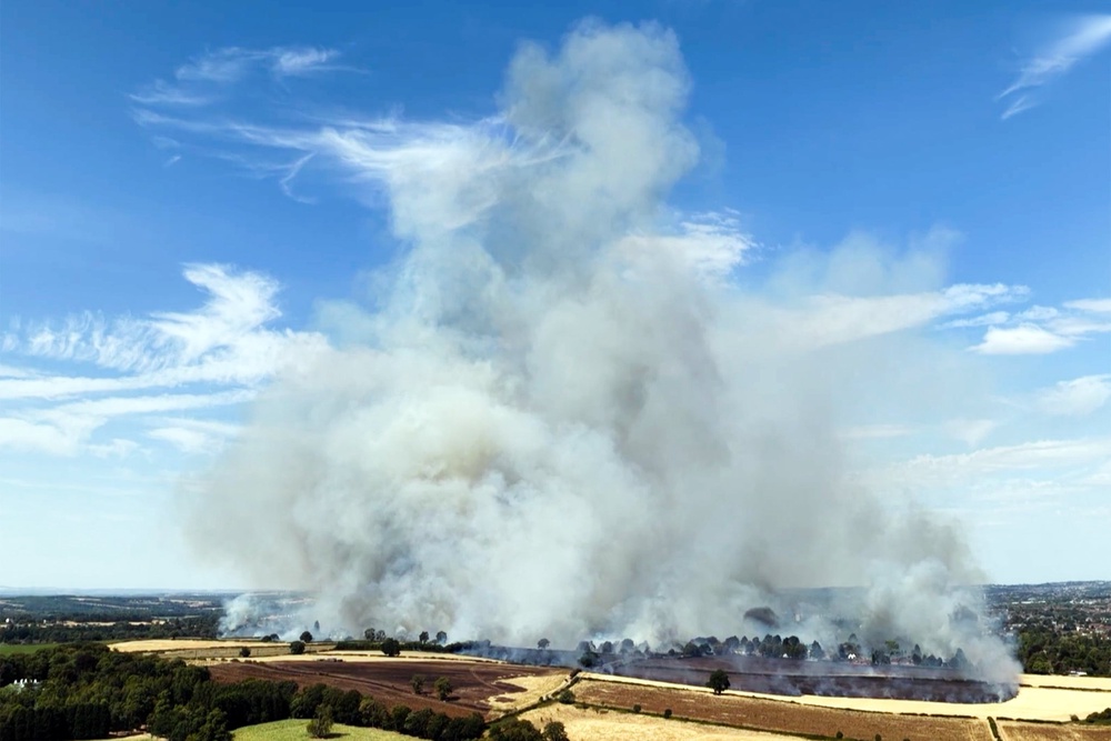 Around 60 firefighters are tackling an extensive grass fire near Stourbridge golf course (ITV)