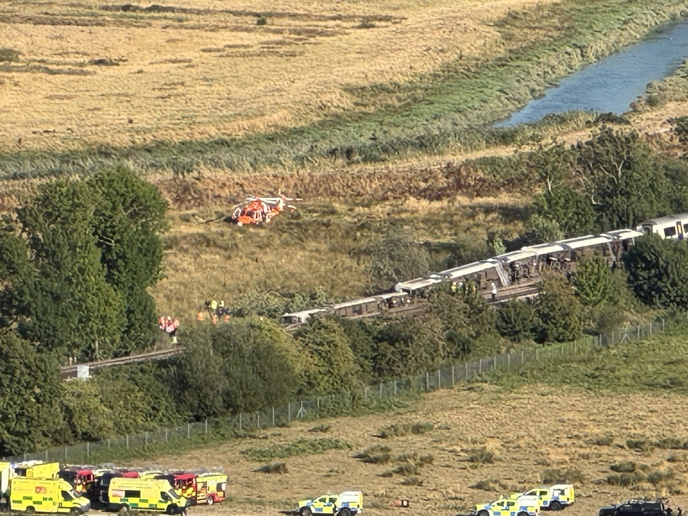 Emergency services at the scene of a train derailment (X/PA) (PA Media)