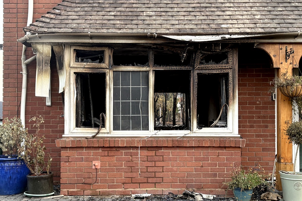 A burnt-out property on Racecourse Lane, Stourbridge ((Matthew Cooper/PA)