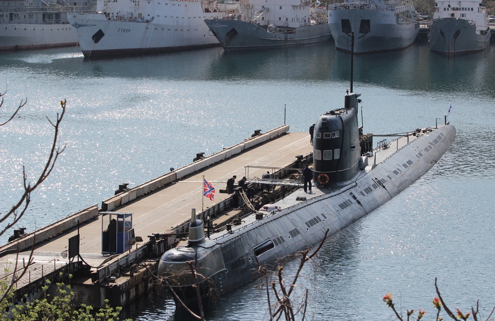 Russian naval flags are seen on the Zaporizhzhia' former Ukrainian submarine moored in the bay of the Crimean port of Sevastopol on April 17, 2014. Ukraine's maritime forces have been severely diminished by the Russian intervention in Crimea after they lost 12 of their 17 warships to Moscow (AFP/Getty)