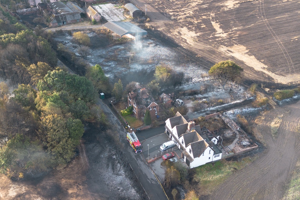 An aerial view shows burnt houses as the wildfire continues to spread to the golf course (Getty)