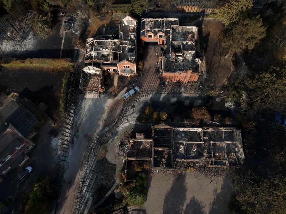The burnt out remains of houses following a huge blaze in Stourbridge, in the West Midlands (PA)