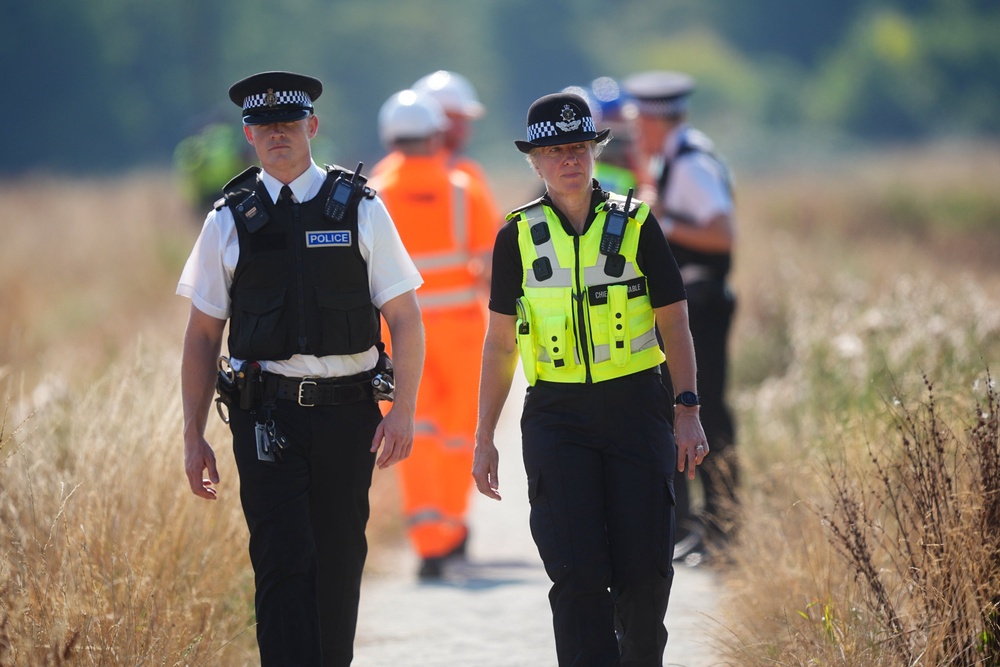 Jo Shiner (right), the Chief Constable of Sussex Police, at the scene (PA)