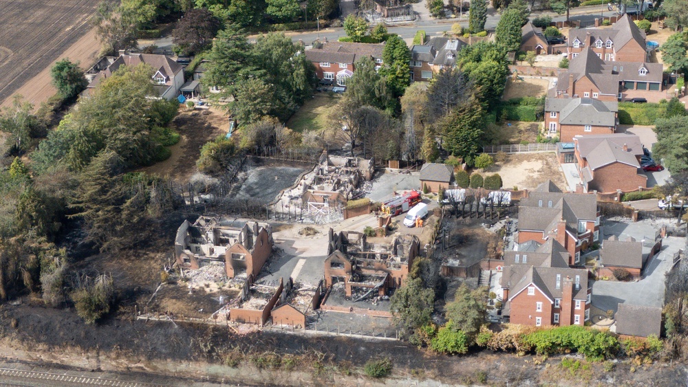 The burnt out remains of houses following a huge blaze in Stourbridge, in the West Midlands (PA)