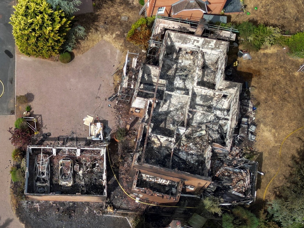 A drone view of a burnt out house in the West Midlands (Reuters)