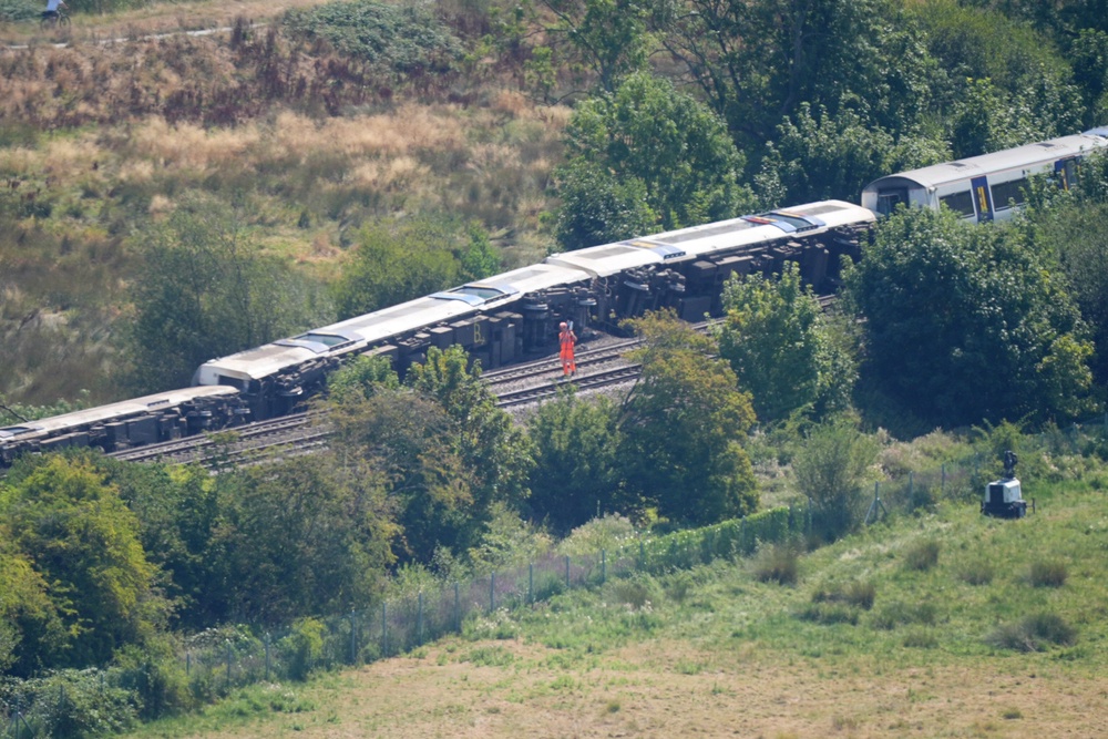 Emergency services at the scene after a train with around 150 people on board derailed near Lewes railway station in East Sussex on Thursday (James Manning/PA) (PA Wire)