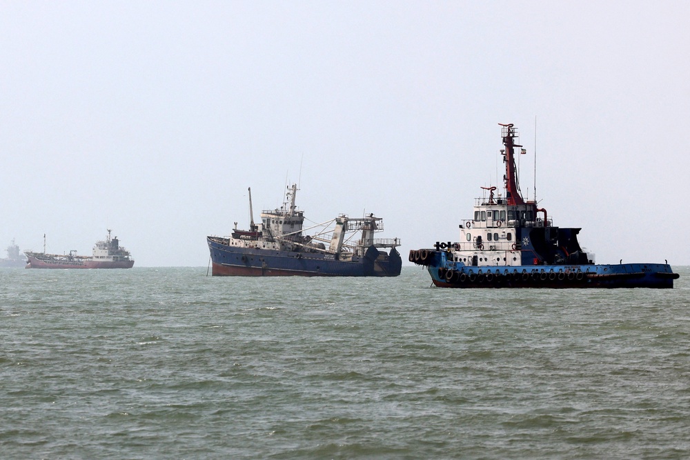 Vessels transit the Strait of Hormuz off Bandar Abbas in southern Iran on 10 August (AFP/Getty)