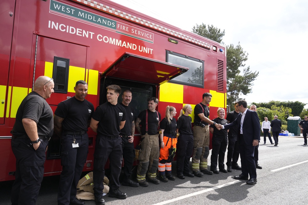 Prime Minister Andy Burnham (right) meets firefighters and staff members of the West Midlands fire service during a visit to Stourbridge to discuss the response to wildfires (Peter Byrne/PA) (PA Wire)