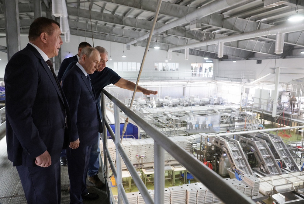 Vladimir Putin visits the Yasny fish-processing complex on the Kuril island of Iturup in the far eastern Sakhalin region of Russia on 13 August 2026 (Reuters)