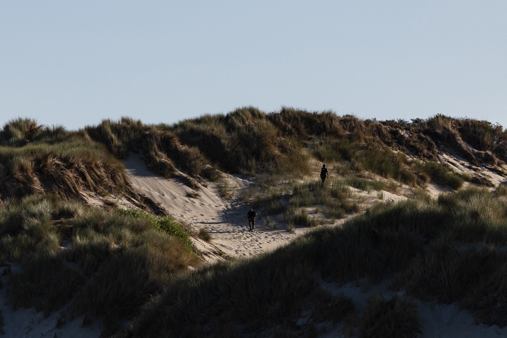 French Gendarmes patrol the dunes to prevent migrants from crossing the English Channel in Fort-Mahon-Plage, northern France, on August 13, 2026. (AFP/Getty)