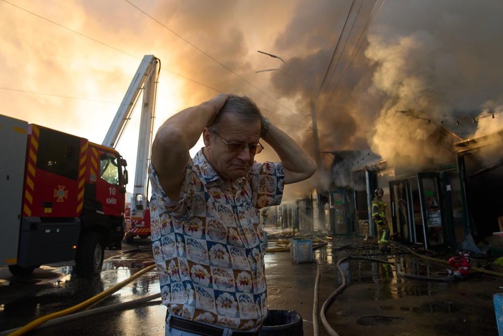 Bookseller Alexander Bahlai reacts as firefighters try to put out a fire at a city book market (Copyright 2026 The Associated Press. All rights reserved)
