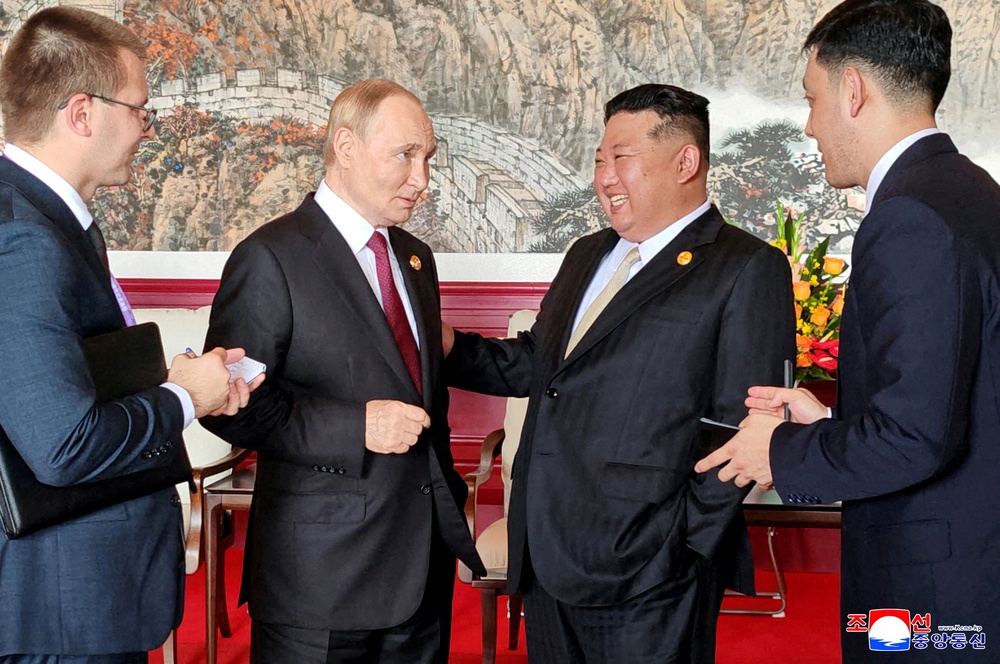 North Korean leader Kim Jong Un speaks with Russian President Vladimir Putin during their visit to Beijing to attend China's commemoration of the 80th anniversary of the end of World War Two, in Beijing, China, September 3, 2025 (Reuters)