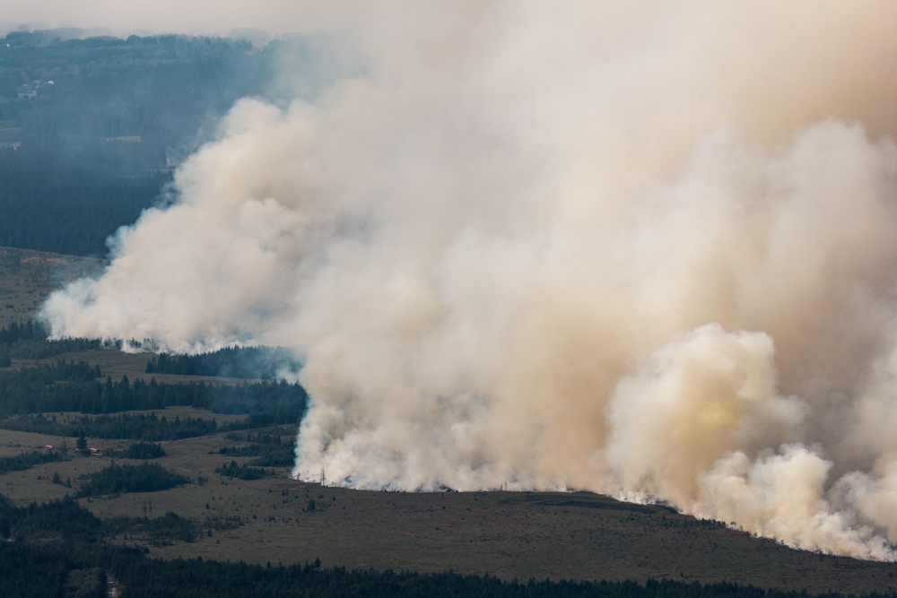 Smoke from a massive wildfire in Belgium's Hohes Venn region is seen from Germany on Aug. 16, 2026 (Christoph Reichwein/dpa via AP)