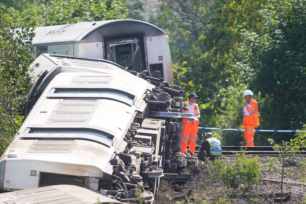 Rail investigators at the scene on Friday (James Manning/PA) (PA Wire)