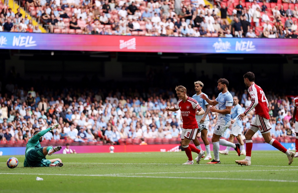 Martin Odegaard scores Arsenal's third goal (Getty)