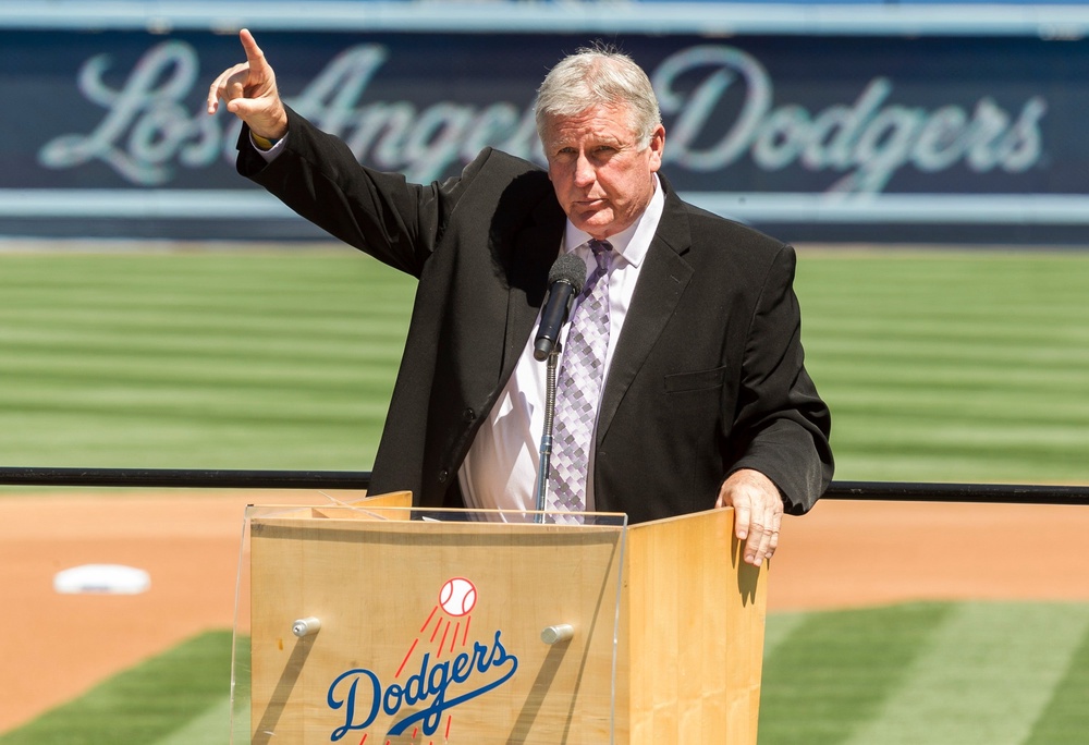 Tommy John praises his late friend, Dr. Frank Jobe during a memorial service at Dodger Stadium in Los Angeles, April 7, 2014 (AP Photo/Damian Dovarganes, File)