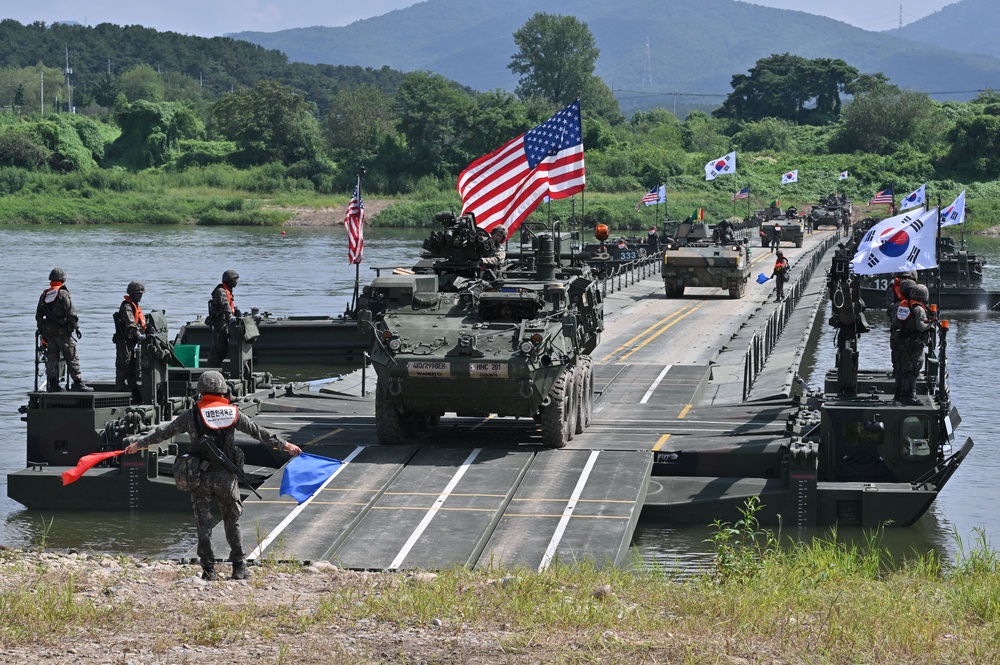 A US Stryker infantry carrier vehicle crosses a river over a floating bridge during a South Korea-US joint river-crossing drill as part of the annual Ulchi Freedom Shield military exercise in 2025 (AFP/Getty)