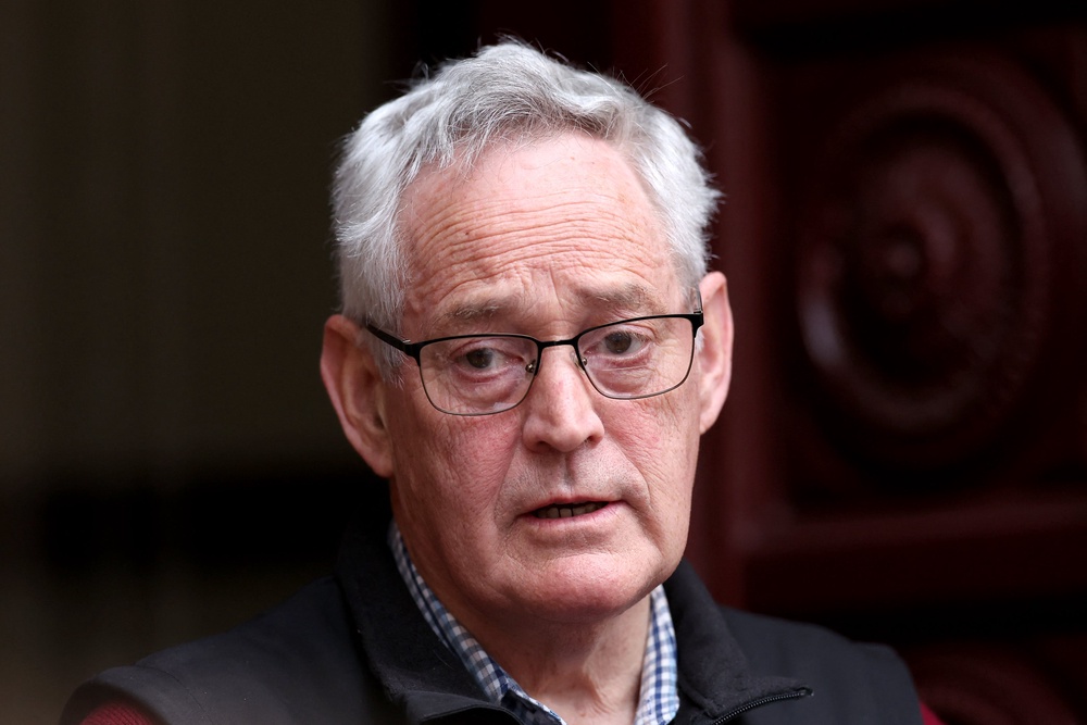 Ian Wilkinson, the only guest to survive the toxic mushroom lunch with Australian murderer Erin Patterson, speaks to members of the media outside the Supreme Court of Victoria in Melbourne on 8 September 2025 (AFP/Getty)