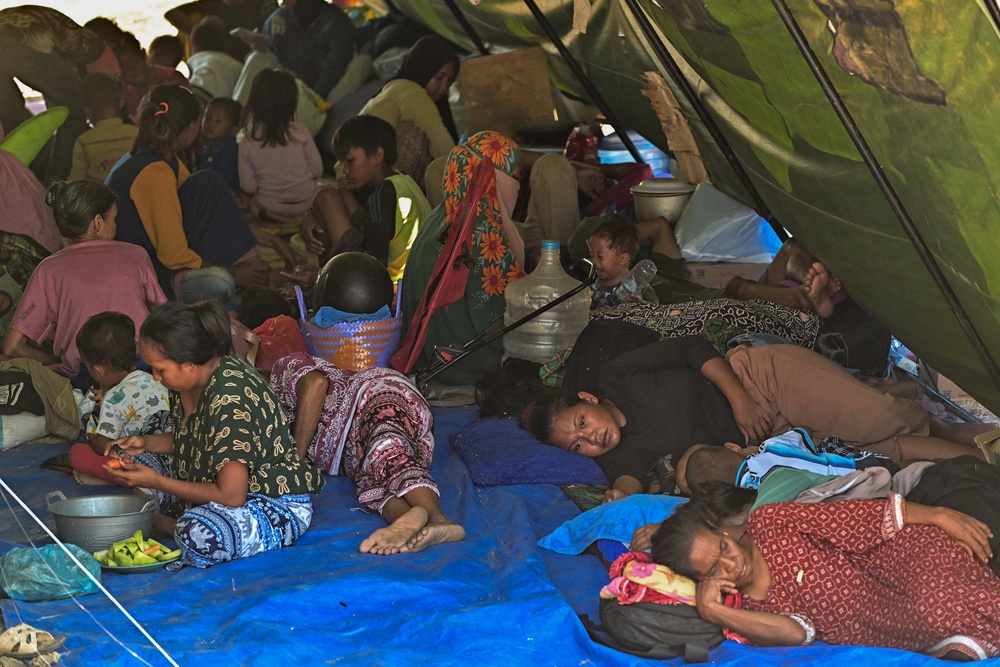 Villagers rest in a tent on an open field in Marapokot, Nagekeo, East Nusa Tenggara (AFP/Getty)