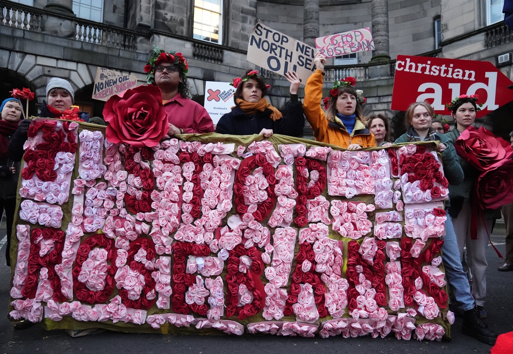 Climate activists from Greenpeace and Uplift (in November 2024) during a demonstration outside the Scottish Court of Session, Edinburgh, on the first day of the Rosebank and Jackdaw judicial review hearing (PA)