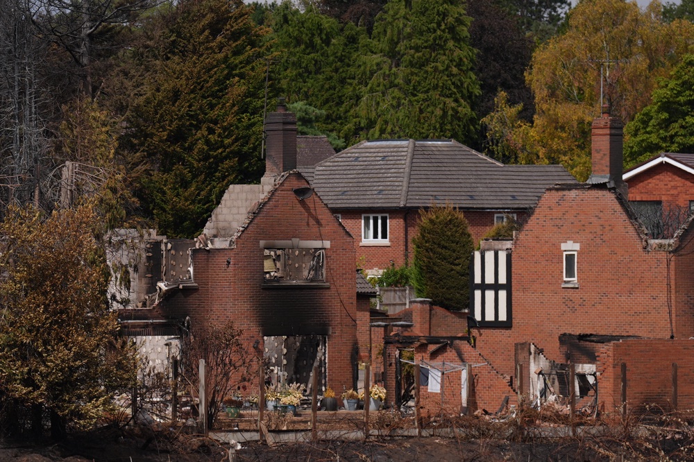 The burnt out remains of a house on Quarry Park Road in Stourbridge (PA)