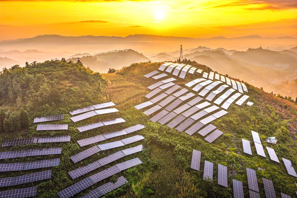 Solar panels are arranged on a hillside at an agricultural photovoltaic power station in Dingxin Yi and Miao Ethnic Township, Qianxi City, in southwestern China's Guizhou province (AFP/Getty)