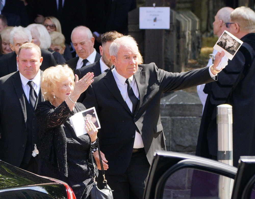 Robert Sullivan waves to the waiting crowd as he leaves the funeral (Ben Birchall/PA) (PA Wire)