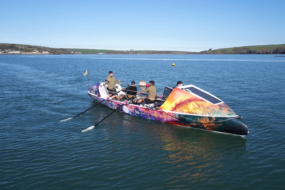 The charity rowers in action (PA Media)