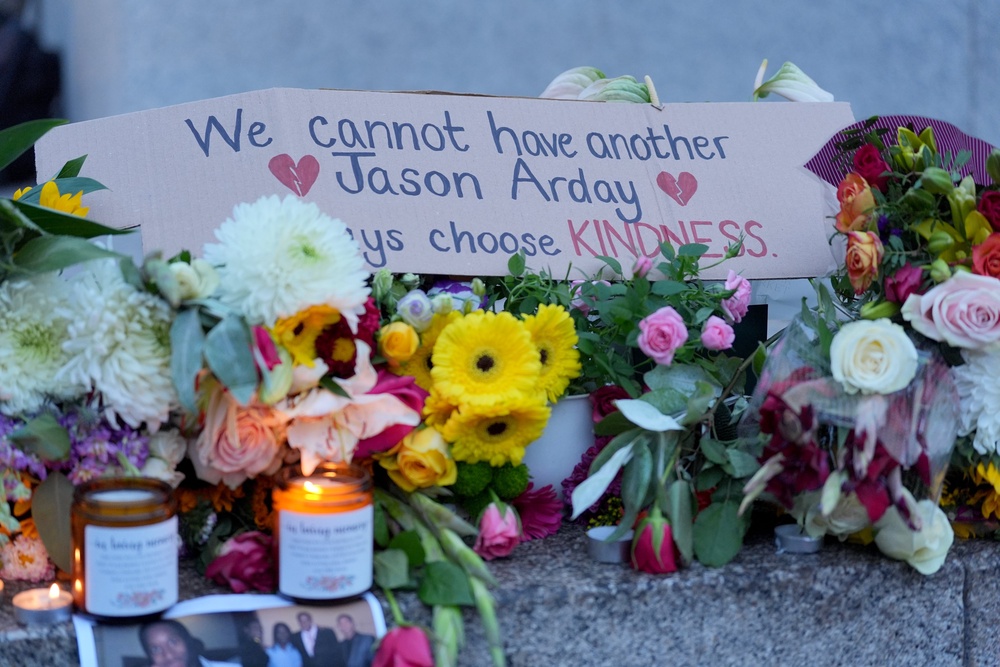 People gathered in Trafalgar Square for the vigil (PA)